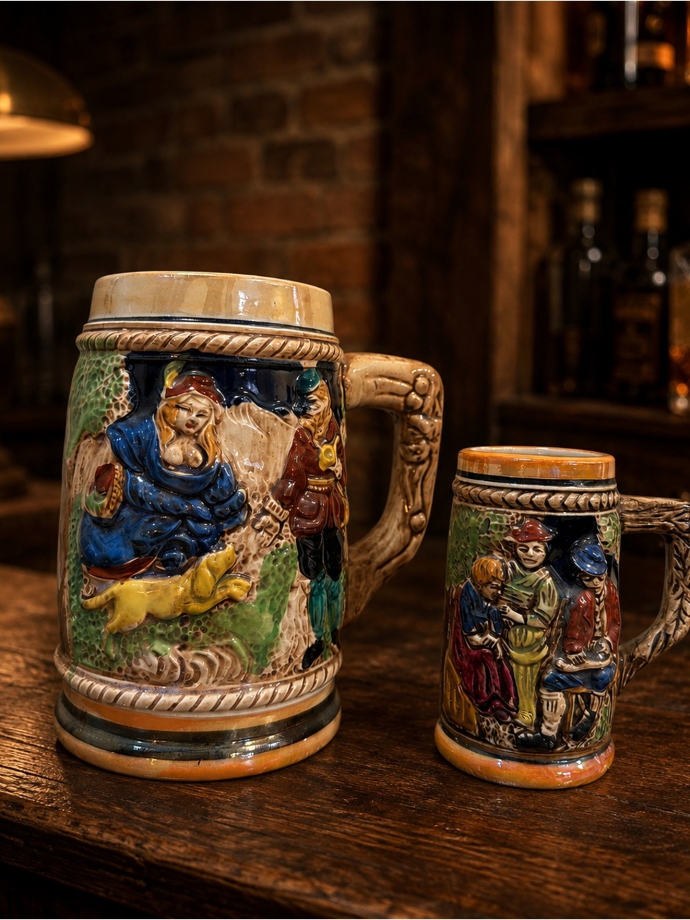 Vintage Japan Ceramic Beer Steins Set of 2 Raised Tavern Scene German Style Mugs